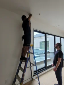 Applying antimicrobial sanitizing fog to residential HVAC air ducts.